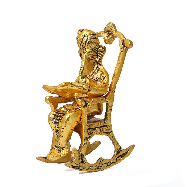 Lord Ganesha Idol Reading Book on Rocking Chair